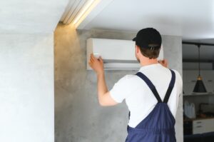 A professional technician repairing AC unit